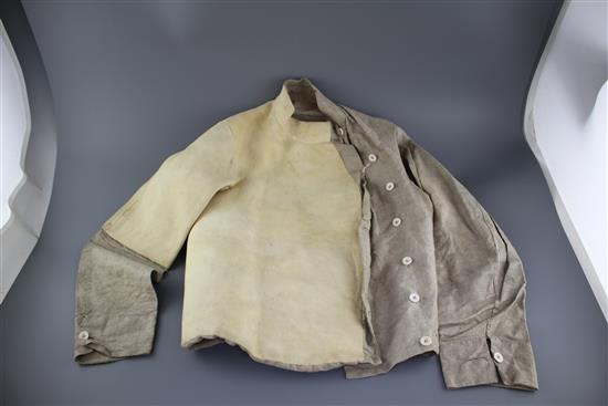 A late 19th century linen fencing jacket, with suede leather protect for body and arm for right handed fencer